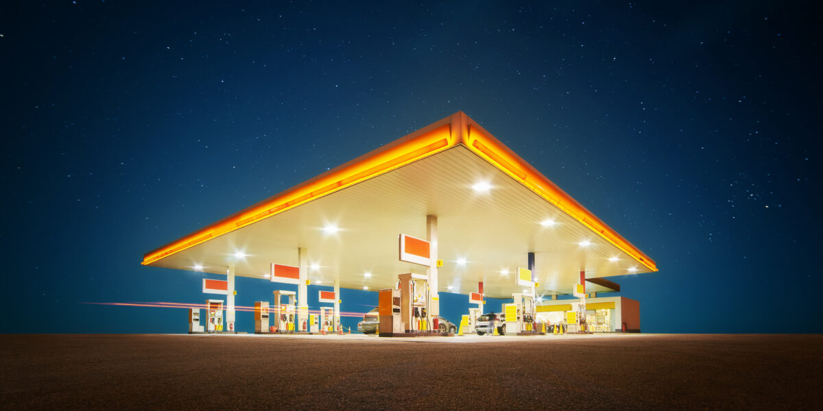 Gas station with retail convenience store at night