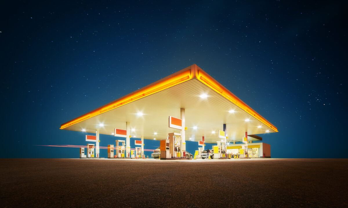 Gas station with retail convenience store at night