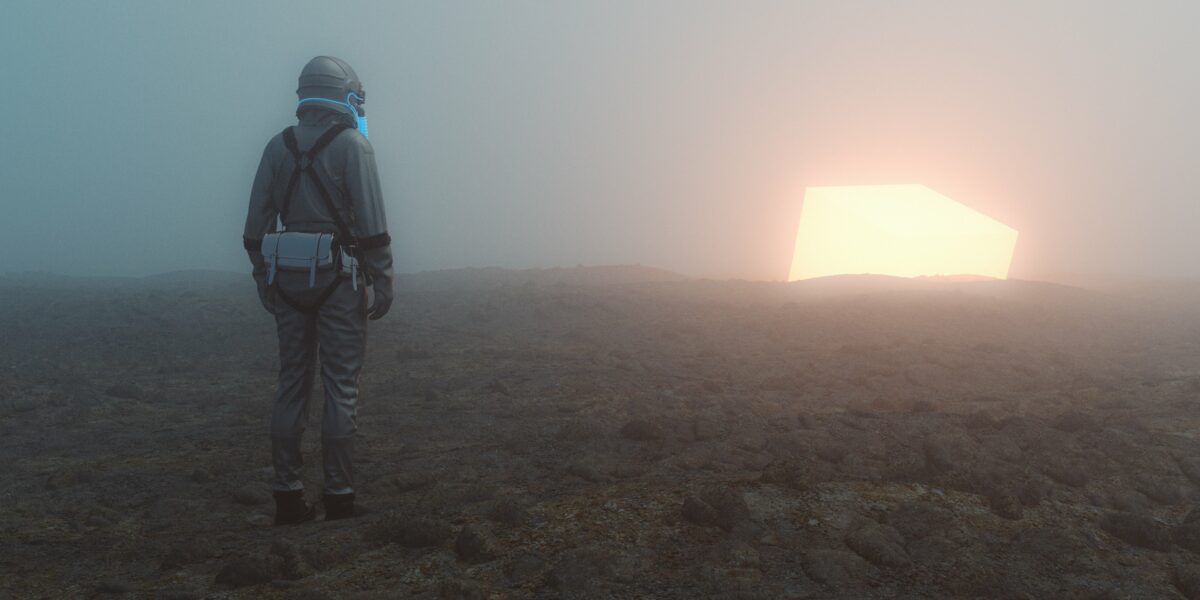 Sole person walking towards the light in a desert wearing a protective suit